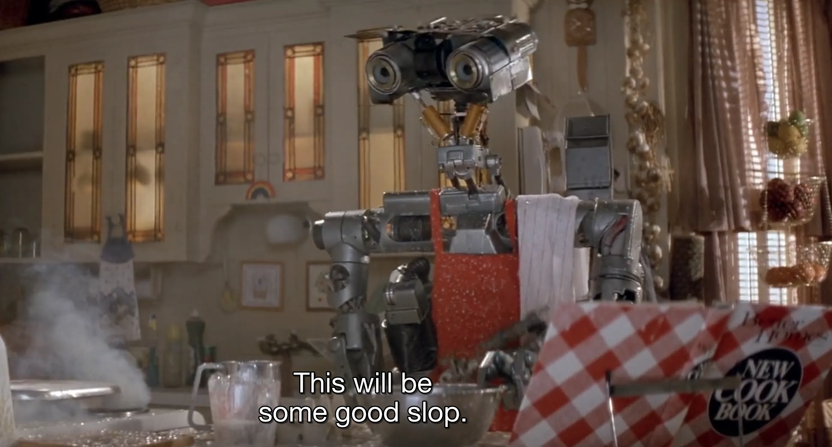Johnny Five, from the film Short Circuit, cooking. This will be some good slop, he says.